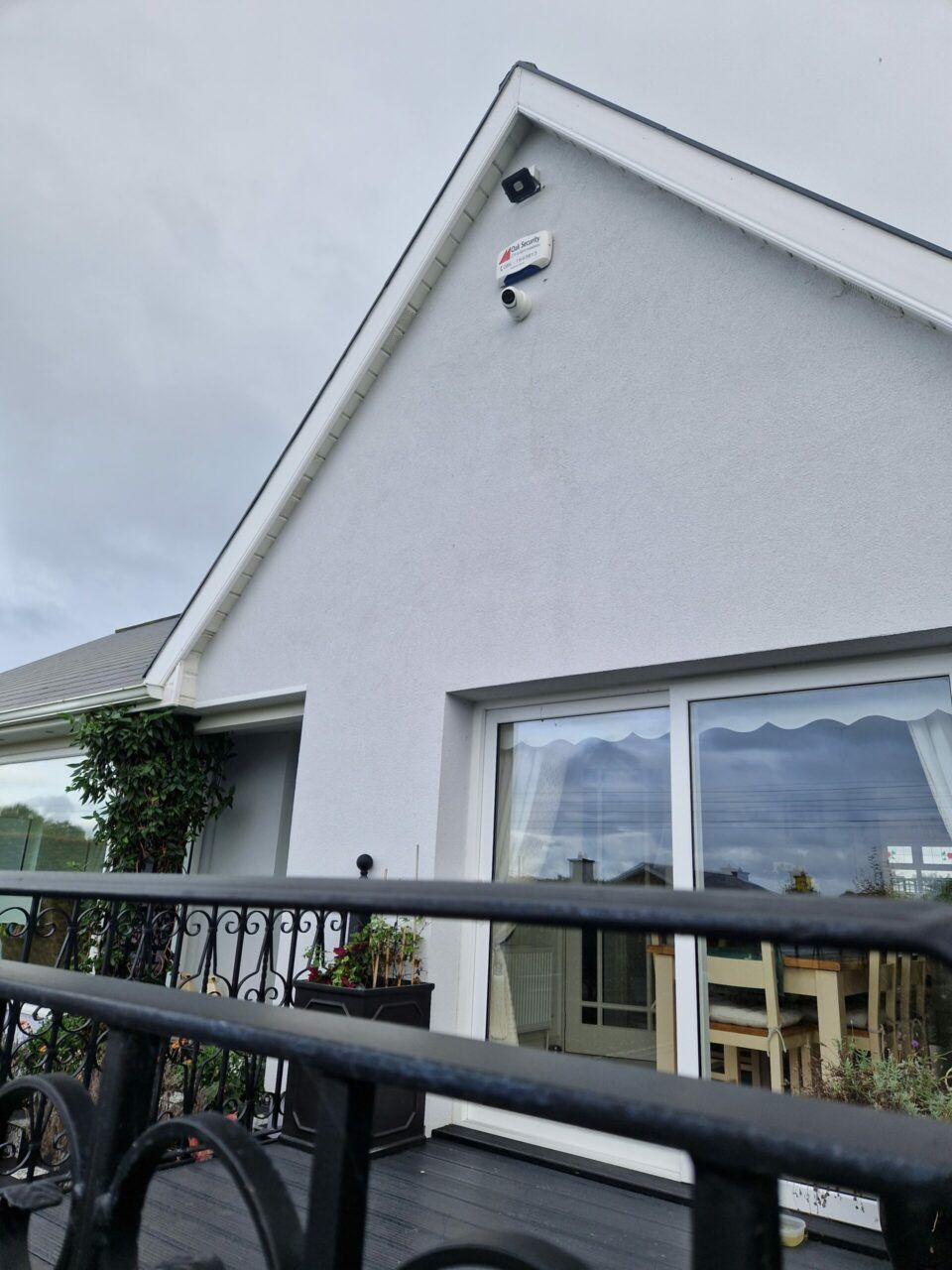 alarm and CCTV camera on front of a house